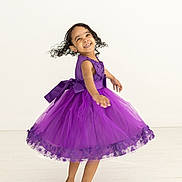 Everleigh joined the competition — help win amazing prizes! child, clothing, dancing, dress, eveningdress, face, fashion, female, footwear, formalwear, girl, gown, head, leisureactivities, person, photography, portrait, purple, sandal, skirt