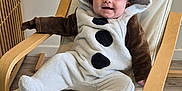 Zélie participe au concours pour gagner de l'argent avec cette photo : baby, infant, child, snowman_costume, costume, hood, smile, chair, wooden_armchair, indoor, plush, onesie, feet, hands, happy, portrait, nursery, flooring, fabric, cute
