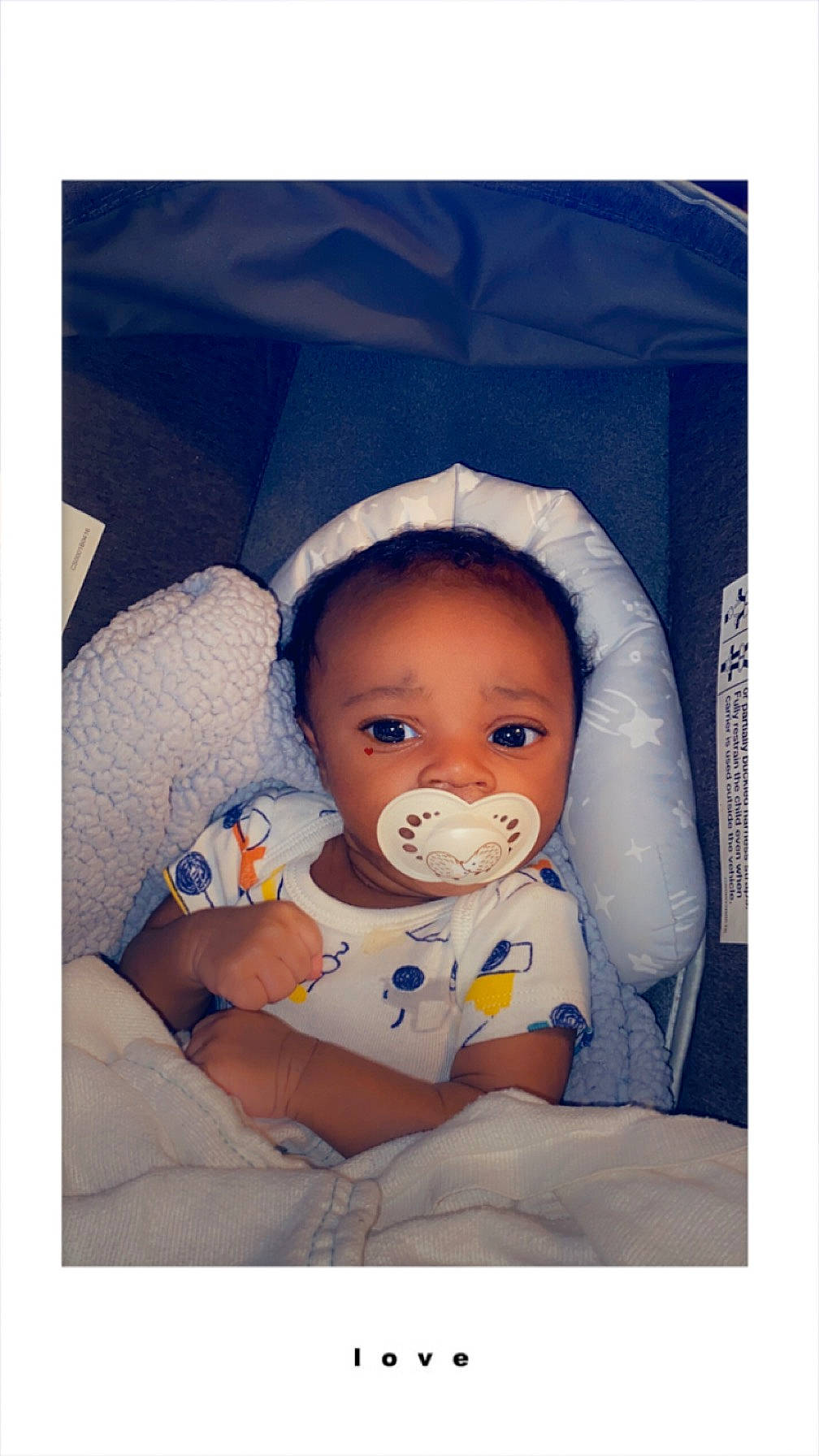 La'Rico joined the competition — help win amazing prizes! baby, baby_products, baby_sleeping, baby_toddler_clothing, cheek, child, comfort, fun, happy, human_body, iris, linens, nose, person, photo_caption, portrait_photography, room, sitting, sleeve, textile