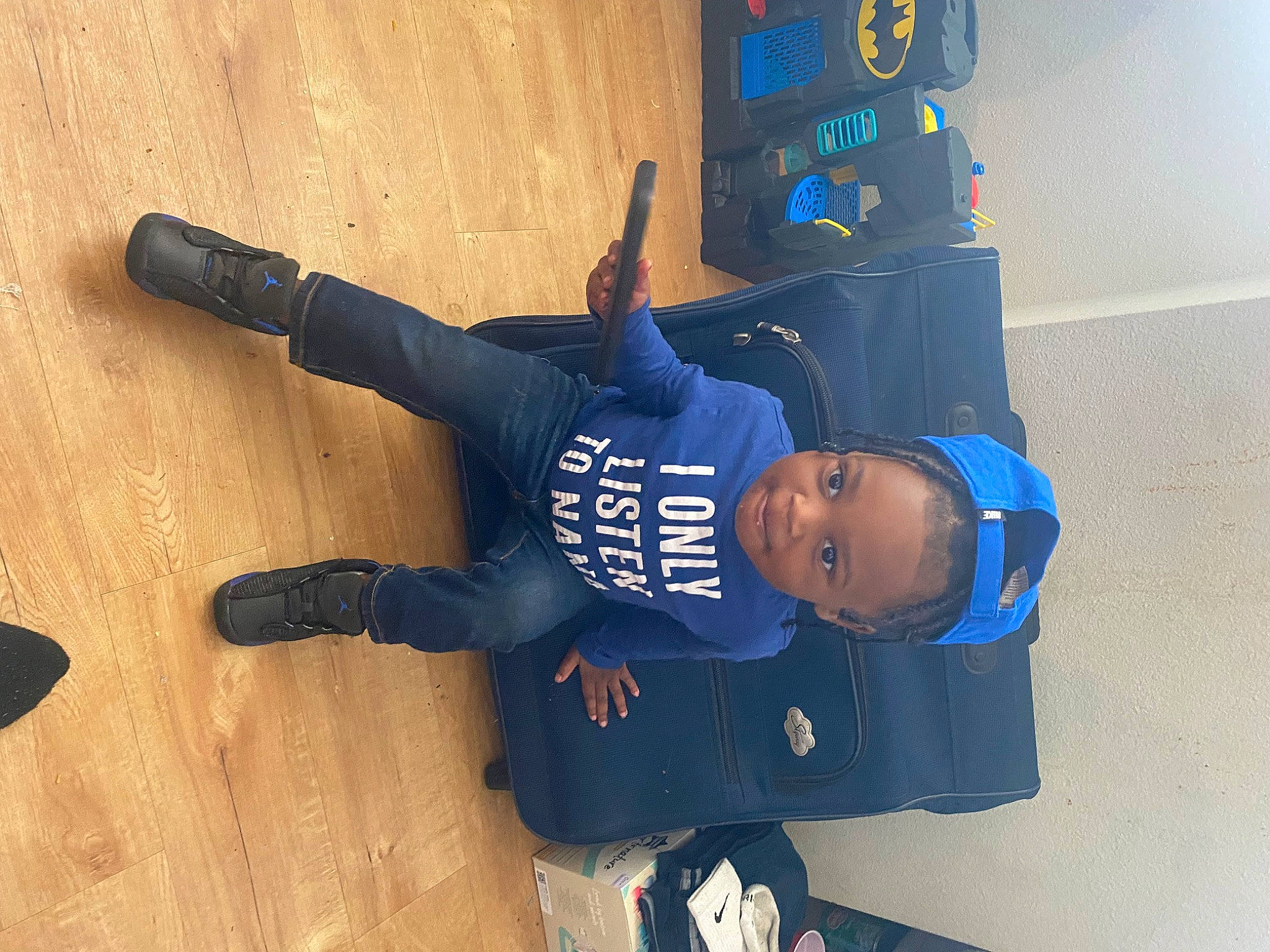 Kairo is registered to the contest to win money with this photo: baseball_cap, cap, child, denim, elbow, electric_blue, flooring, fun, glove, hardwood, hat, helmet, person, personal_protective_equipment, sleeve, sports_uniform, sportswear, thumb, toddler, travel
