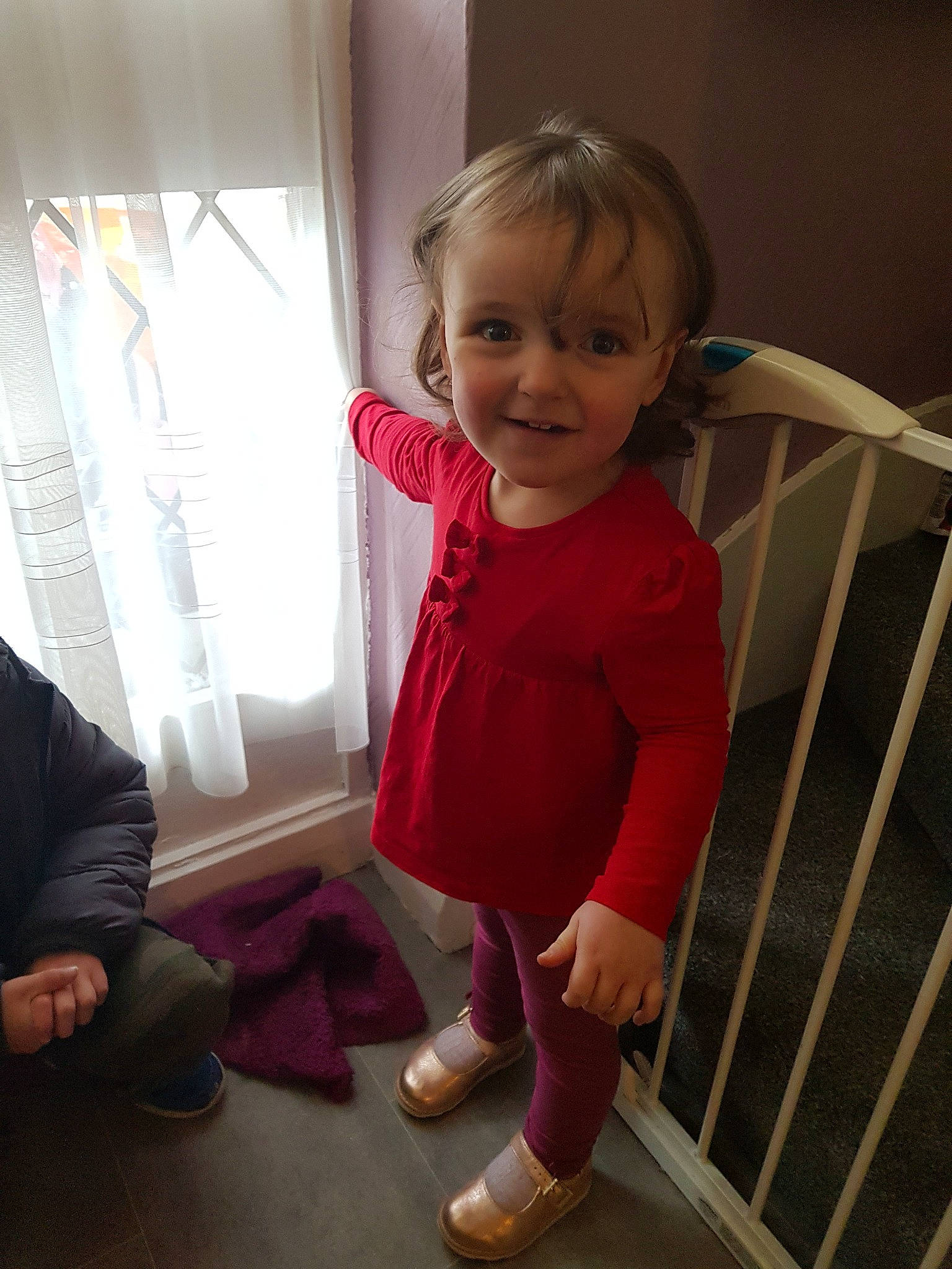 Chloe is registered to the contest to win money with this photo: arm, baby, baby_products, cheek, child, joy, leg, magenta, outerwear, person, product, sitting, skin, smile, standing, toddler