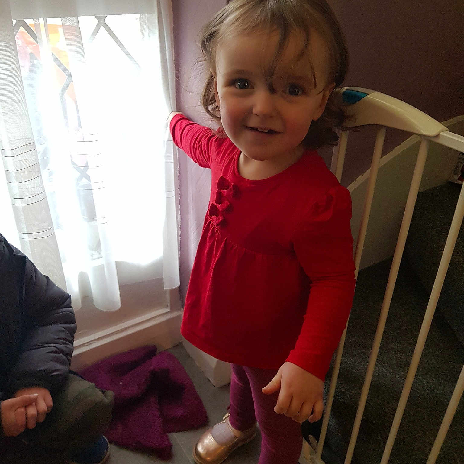 Chloe is registered to the contest to win money with this photo: arm, baby, baby_products, cheek, child, joy, leg, magenta, outerwear, person, product, sitting, skin, smile, standing, toddler