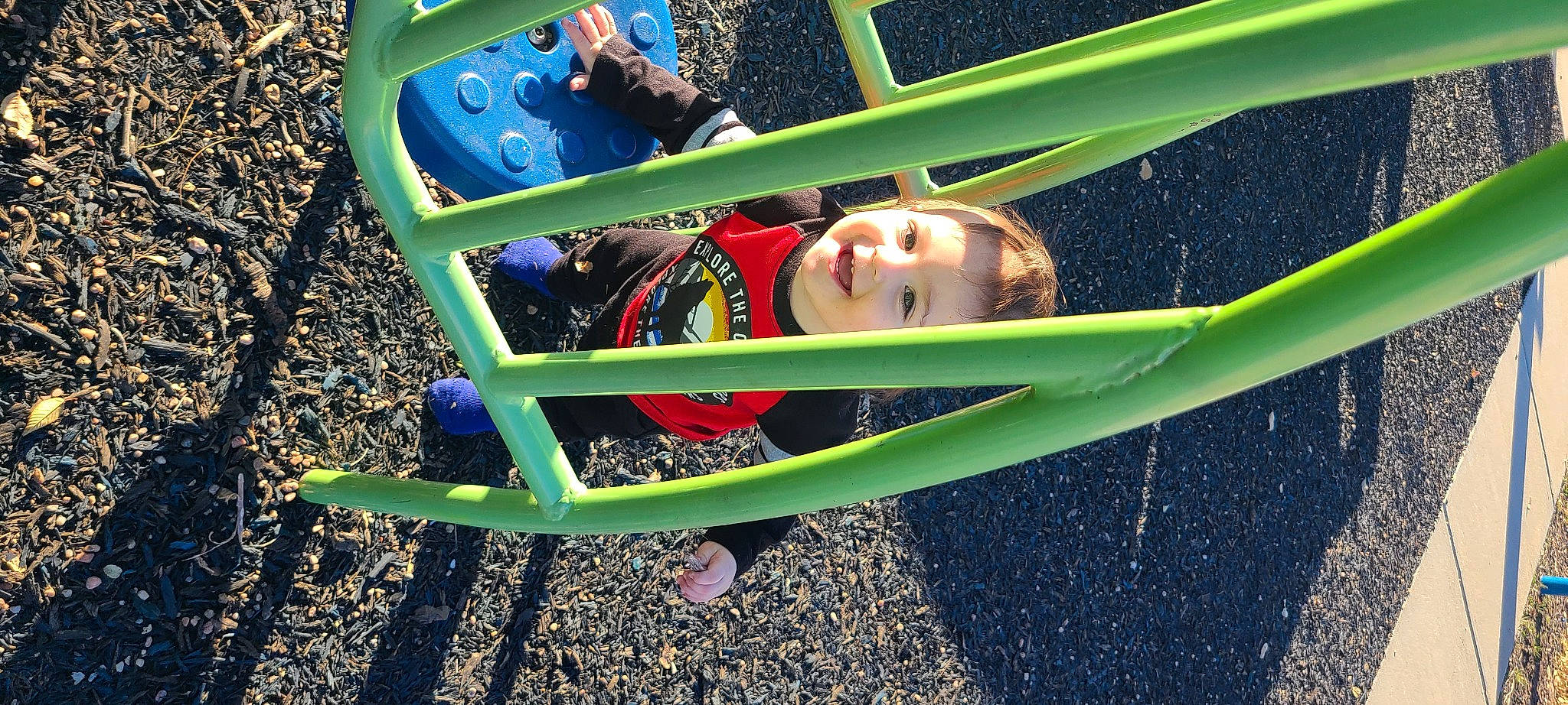 Abel is registered to the contest to win money with this photo: child, chute, city, electric_blue, fun, grass, happy, joy, landscape, lawn, leisure, light, outdoor_furniture, outdoor_play_equipment, people_in_nature, person, play, recreation, shade, sitting