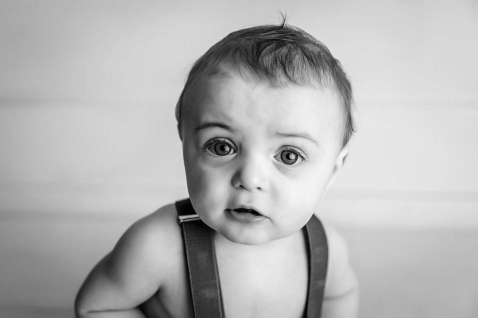 Calum is registered to the contest to win money with this photo: arm, baby, cheek, chin, ear, eye, eyebrow, eyelash, face, flash_photography, hair, head, human_body, iris, jaw, lip, neck, nose, person, shoulder