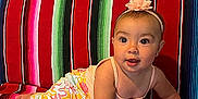 Janelle is registered to the contest to win money with this photo: accessories, architecture, baby, bodypart, building, clothing, couch, crawling, cushion, face, finger, furniture, hand, hat, head, homedecor, person, photography, portrait, sitting