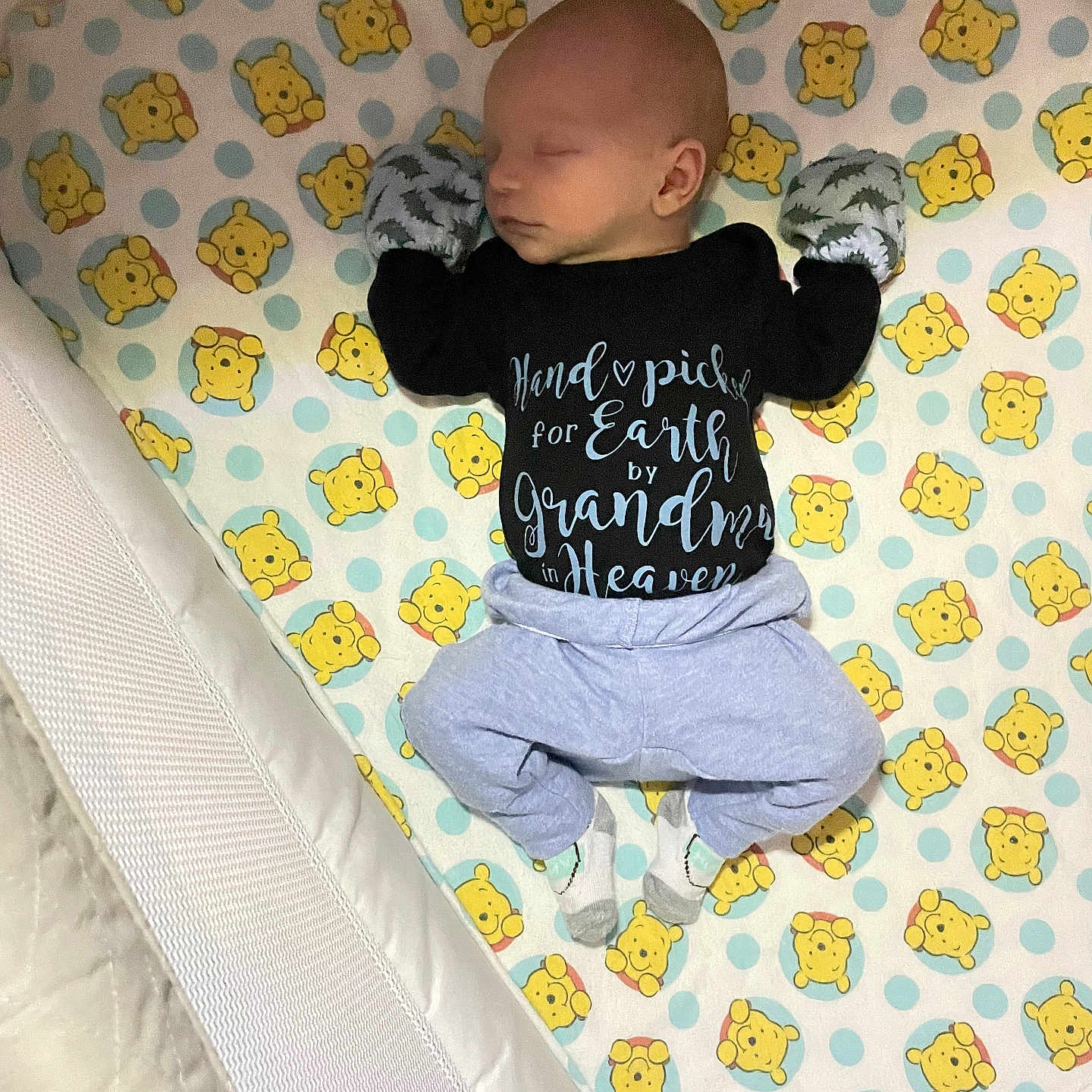 Bentley is registered to the contest to win money with this photo: baby, bed, blanket, clothing, cradle, crib, cushion, face, footwear, furniture, head, homedecor, indoors, infantbed, pants, person, photography, portrait, shoe, standing