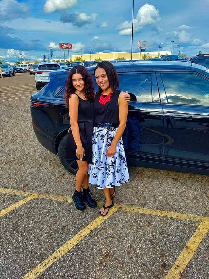 Olivia is registered to the contest to win money with this photo: asphalt, automotive_design, automotive_exterior, automotive_lighting, automotive_tire, car, cloud, cool, happy, joy, morning, motor_vehicle, person, sky, smile, standing, street_fashion, summer, tire, travel