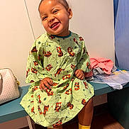 Heaven joined the competition — help win amazing prizes! child, toddler, smiling, sitting, hospital_gown, yellow_socks, earring, bench, indoor, clothing, happy, face, person, wooden_floor, bag, curtain, wall, casual, cute, portrait