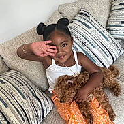 Amari joined the competition — help win amazing prizes! animal, canine, child, couch, cushion, dog, face, female, furniture, girl, happy, head, homedecor, person, pet, photography, portrait, puppy, sitting, smile