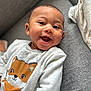 Kaïs participe au concours pour gagner de l'argent avec cette photo : baby, smiling, sweater, fox_print, couch, indoor, child, happy, face, infant, portrait, person, clothing, cute, young, cozy, relaxed, home, skin, head