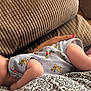 Lucas is registered to the contest to win money with this photo: baby, blanket, cartoon, child, closeup, comfort, couch, fabric, feet, hand, home, indoor, infant, onesie, pattern, peaceful, person, resting, sleeping, texture