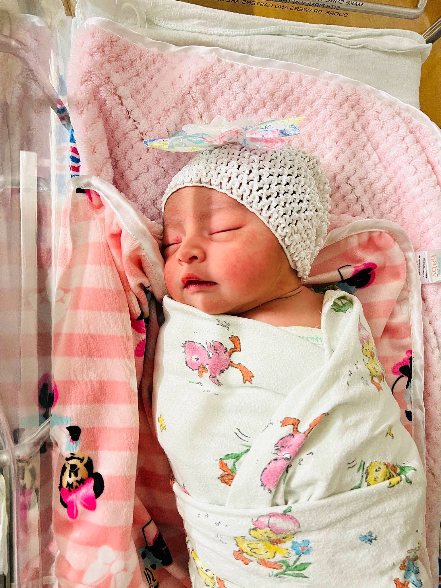 Lexie joined the competition — help win amazing prizes! baby, baby_products, baby_safety, baby_sleeping, baby_toddler_clothing, bedding, cap, cheek, child, comfort, headgear, headwear, knit_cap, linens, magenta, pattern, person, pink, product, room