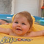 Abbygaël participe au concours pour gagner de l'argent avec cette photo : baby, child, swim_ring, pool, water, smile, happy, face, infant, floating, yellow, outdoor, summer, cute, skin, person, head, fun, play, relax