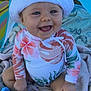 Abbygaël participe au concours pour gagner de l'argent avec cette photo : baby, child, smiling, hat, sunhat, floral, swimsuit, long_sleeve, toy, blanket, outdoor, playful, happy, sitting, blue, face, skin, person, toddler, canopy