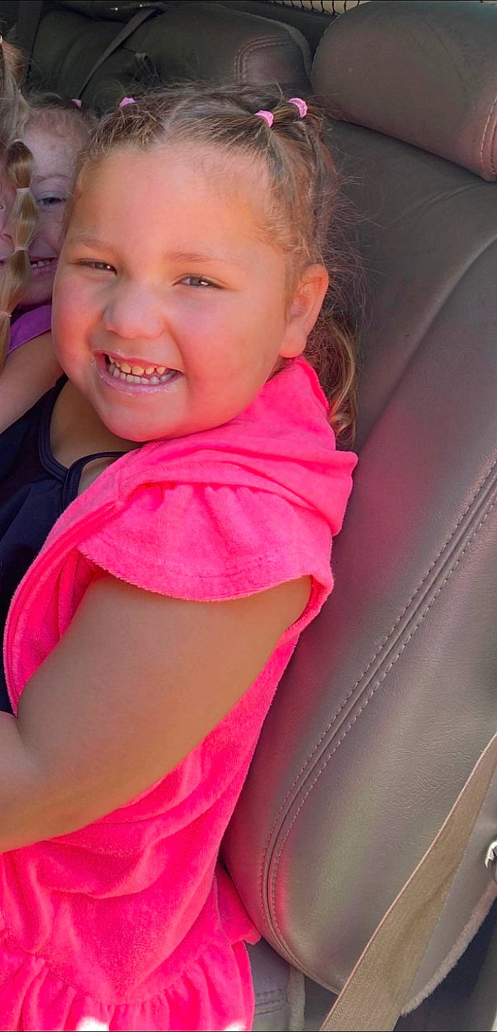 Kyrie joined the competition — help win amazing prizes! baby_products, car_seat, child, chin, eyebrow, fun, grass, hair, happy, iris, joy, leisure, lip, magenta, person, pink, skin, smile, toddler, vehicle_door