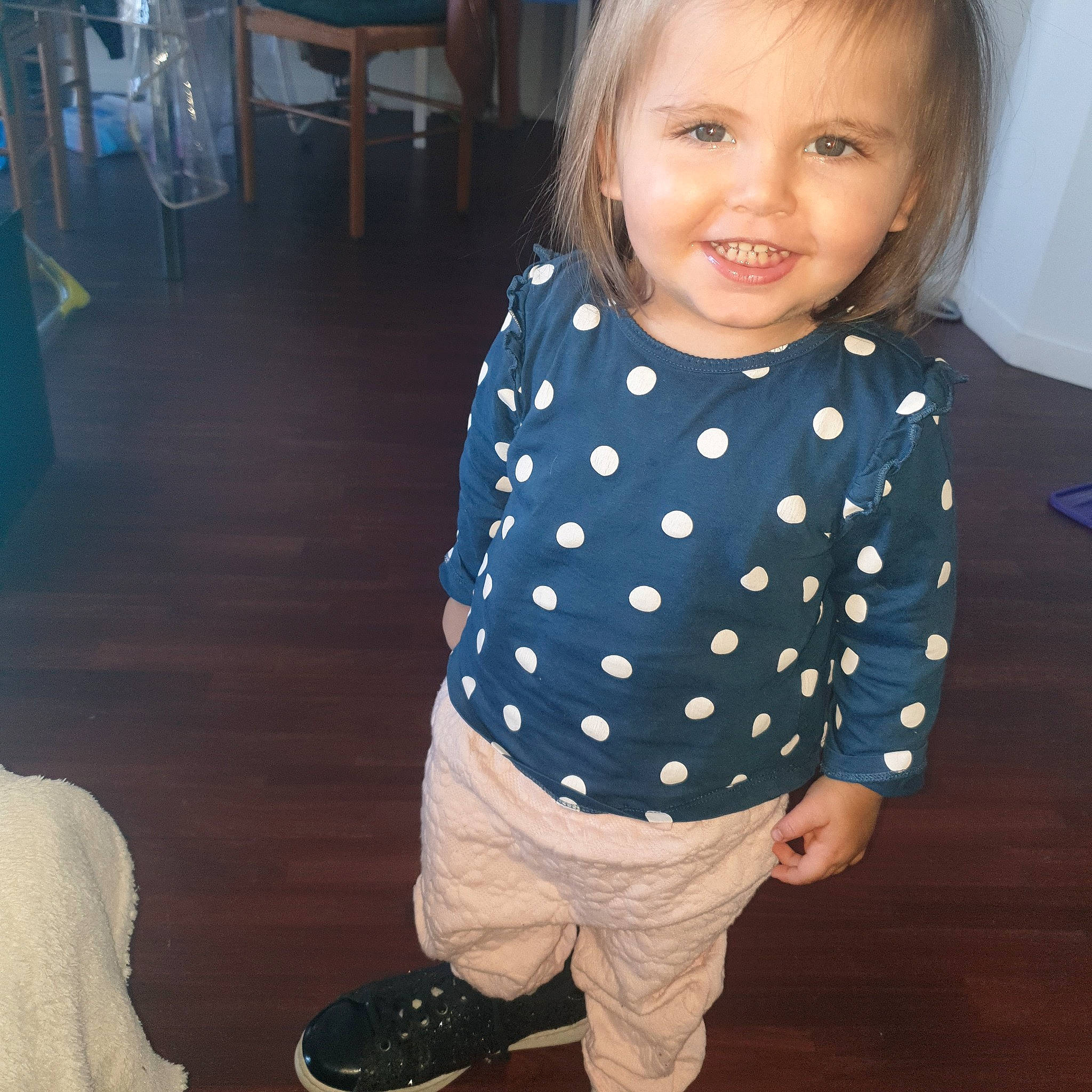 Sheryne participe au concours pour gagner de l'argent avec cette photo : baby, blue, cheek, child, clothing, cool, design, eye, face, footwear, head, joy, outerwear, pattern, person, polka_dot, skin, sleeve, smile, standing