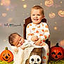 baby, blanket, child, cozy, cute, decor, green_carpet, halloween, happy, holiday, indoor, jackolantern, pajamas, plush_toy, portrait, pumpkins, siblings, sleeping, smiling, wooden_bucket