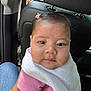 Daleyza joined the competition — help win amazing prizes! baby, child, infant, face, pink_clothing, hair_clip, blanket, car_interior, seat, headrest, person, skin, cute, young_child, portrait, indoors, hand, denim, sitting, closeup