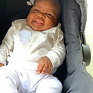 Peace joined the competition — help win amazing prizes! adorable, baby, cheerful, child, closeup, face, fingers, gray, hands, happy, indoor, infant, onesie, photography, portrait, seated, short_hair, smiling, stroller, white_outfit