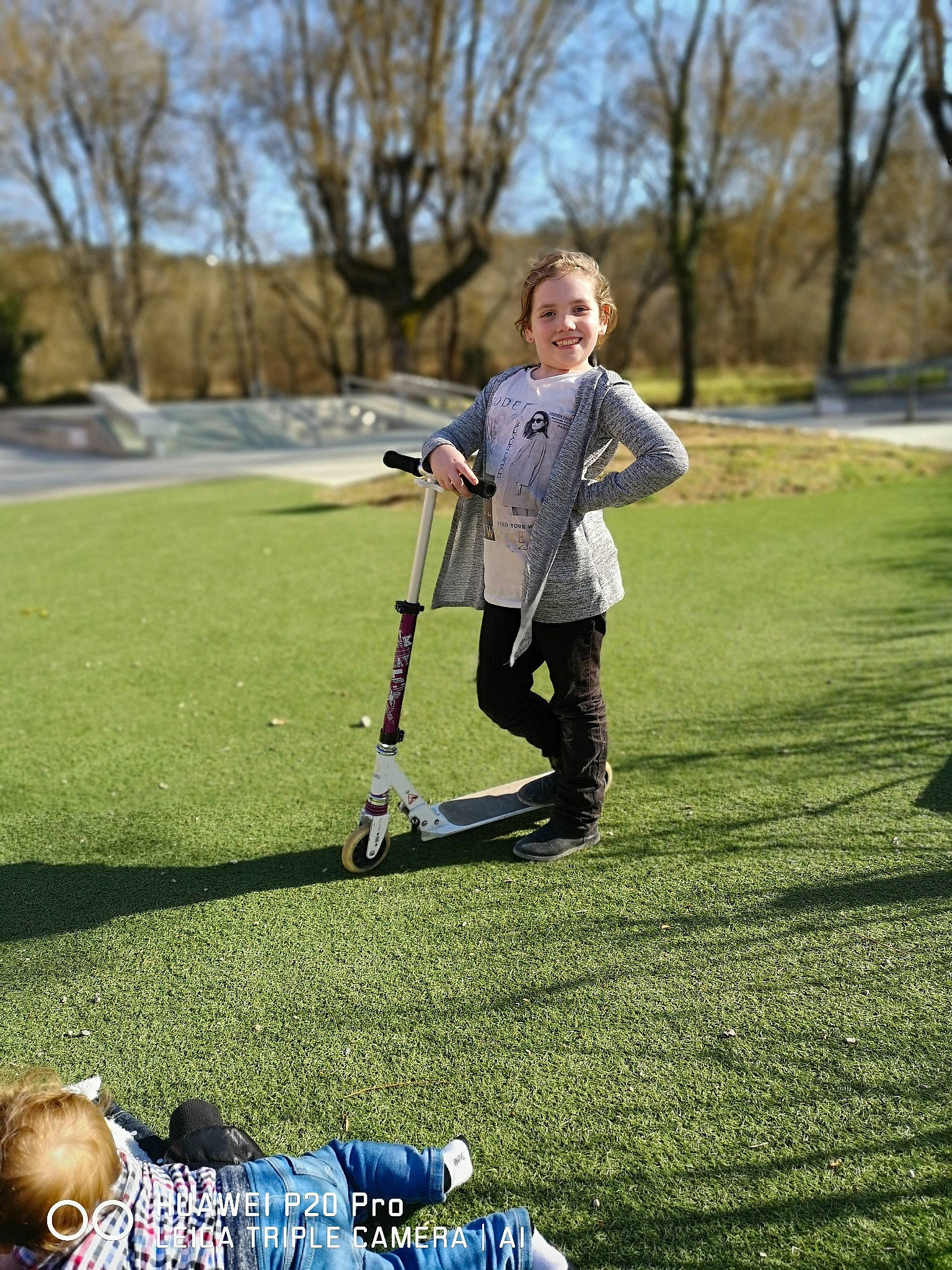 Maelys participe au concours pour gagner de l'argent avec cette photo : child, fun, games, grass, joy, kick_scooter, lawn, park, person, plant, play, recreation, spring, toddler, tree, vehicle