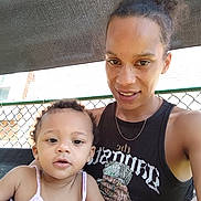 Toshia Harris joined the competition — help win amazing prizes! woman, toddler, child, outdoor, selfie, smile, freckles, tank_top, chain_link_fence, shade, curly_hair, pink_clothing, casual, portrait, parent_and_child, daylight, person, happy, cute, family