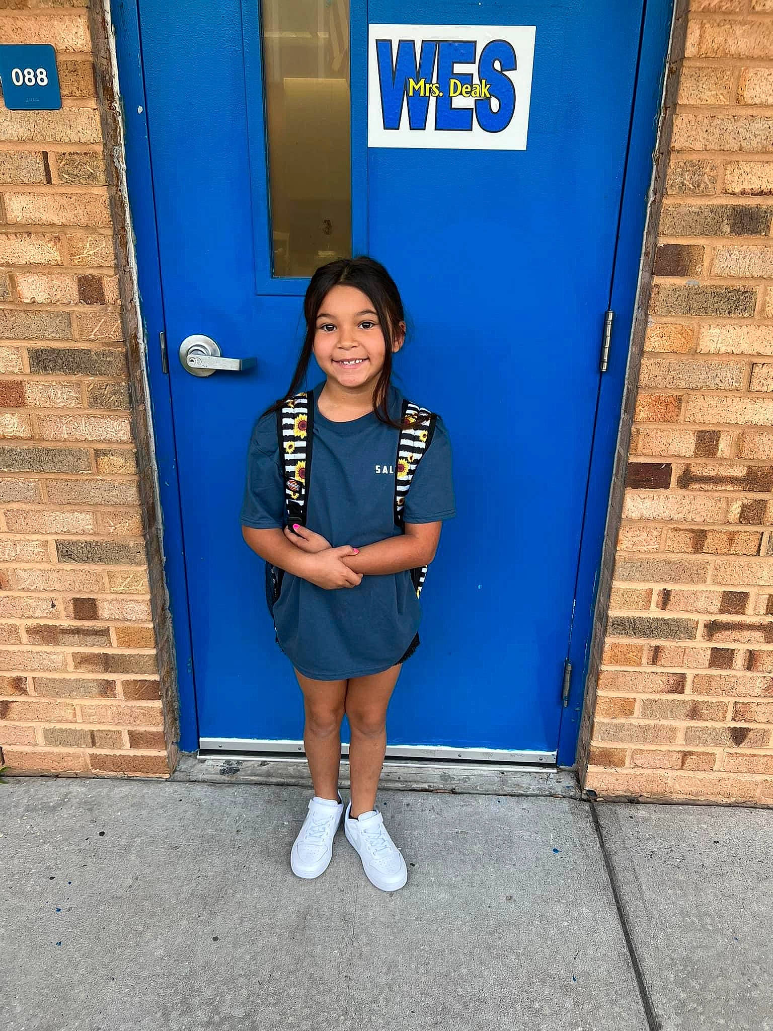 Ava joined the competition — help win amazing prizes! brick, brickwork, door, electric_blue, human_leg, joy, knee, pattern, person, sleeve, smile, thigh, uniform