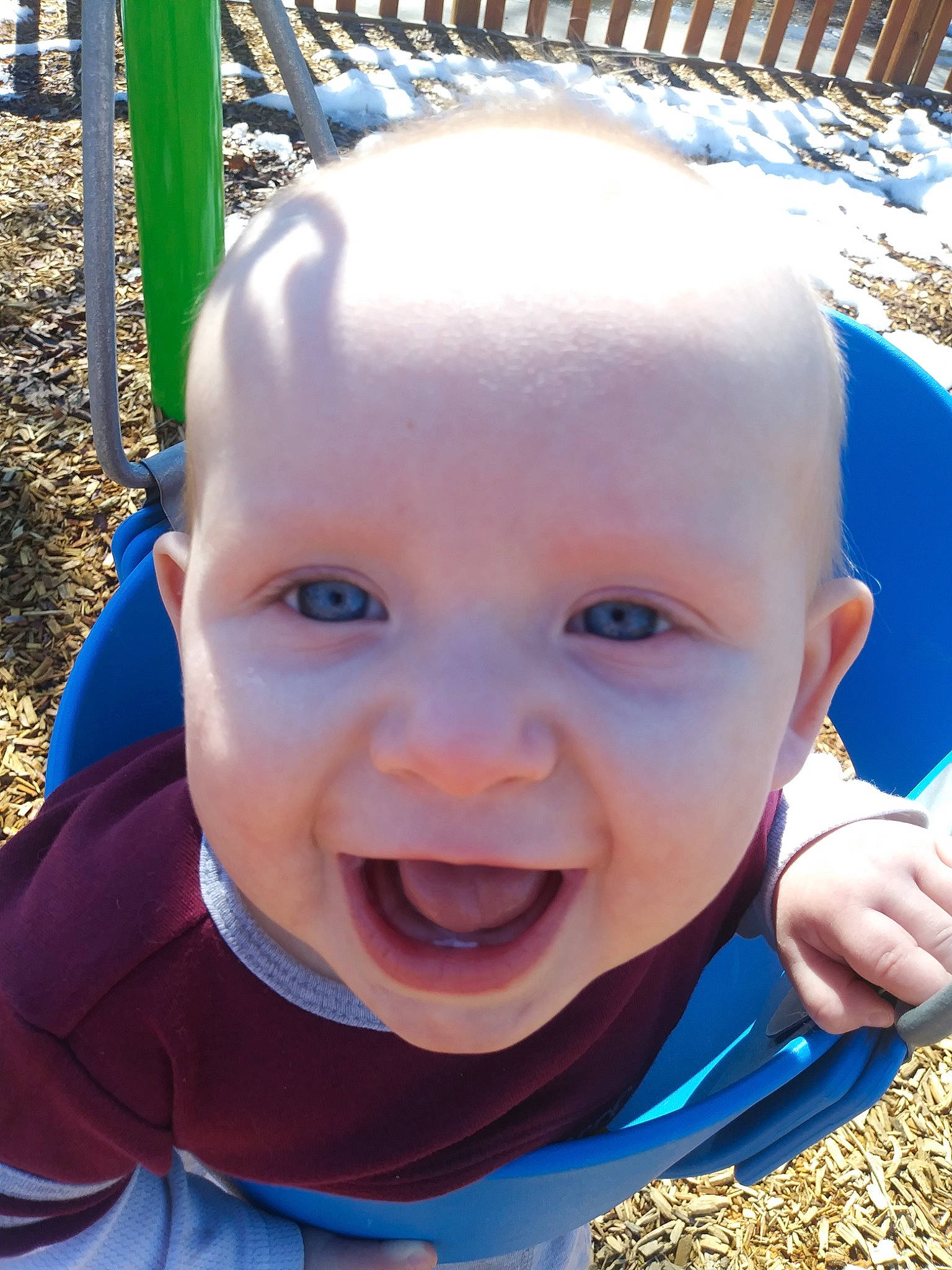 Enoch joined the competition — help win amazing prizes! baby, blue, cheek, child, chin, eye, face, facial_expression, forehead, head, human_settlement, nose, organ, outdoor_play_equipment, person, playground, public_space, skin, smile, swing