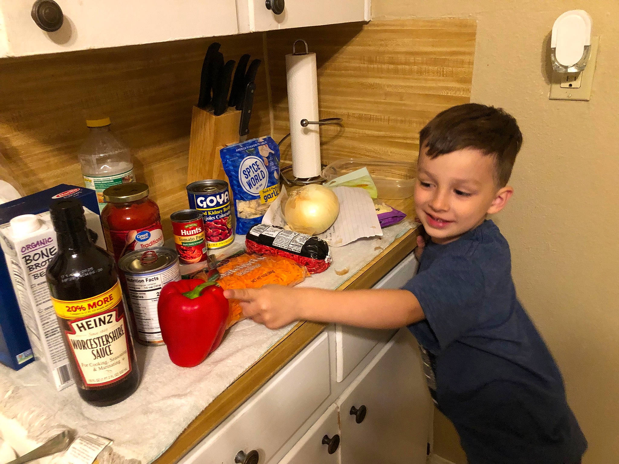 Addyson is registered to the contest to win money with this photo: bottle, bottle_cap, cooking, countertop, drink, gas, home_appliance, homemaker, joy, kitchen, kitchen_appliance, major_appliance, person, plastic_bottle, refrigerator, room, service, smile, solution, solvent