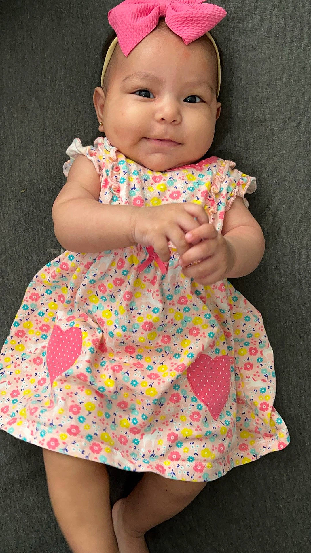 Aylani joined the competition — help win amazing prizes! accessories, applique, baby, cap, clothing, dress, face, formalwear, happy, hat, head, headband, pattern, person, photography, portrait, sitting, skirt, sleeve, smile