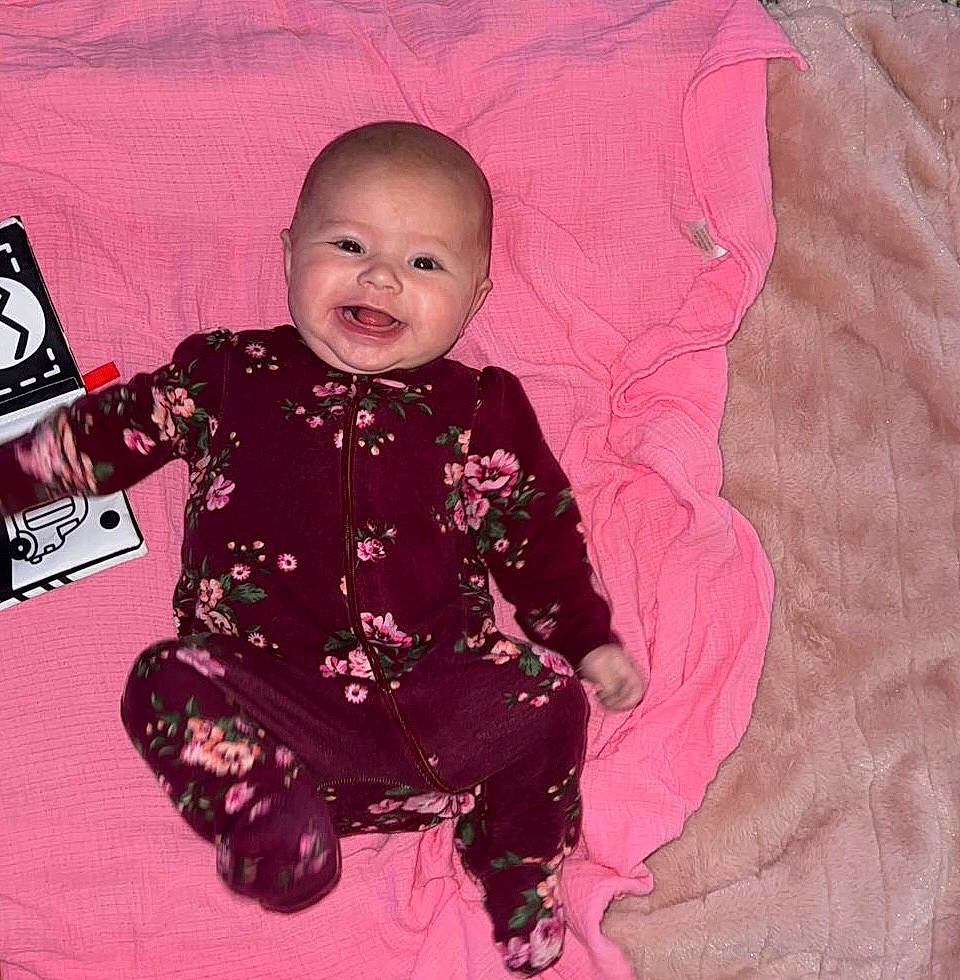 Irelynn joined the competition — help win amazing prizes! baby, baby_products, baby_toddler_clothing, carmine, cheek, child, comfort, design, fun, happy, linens, magenta, pattern, person, pink, purple, sitting, sleeve, smile, t_shirt