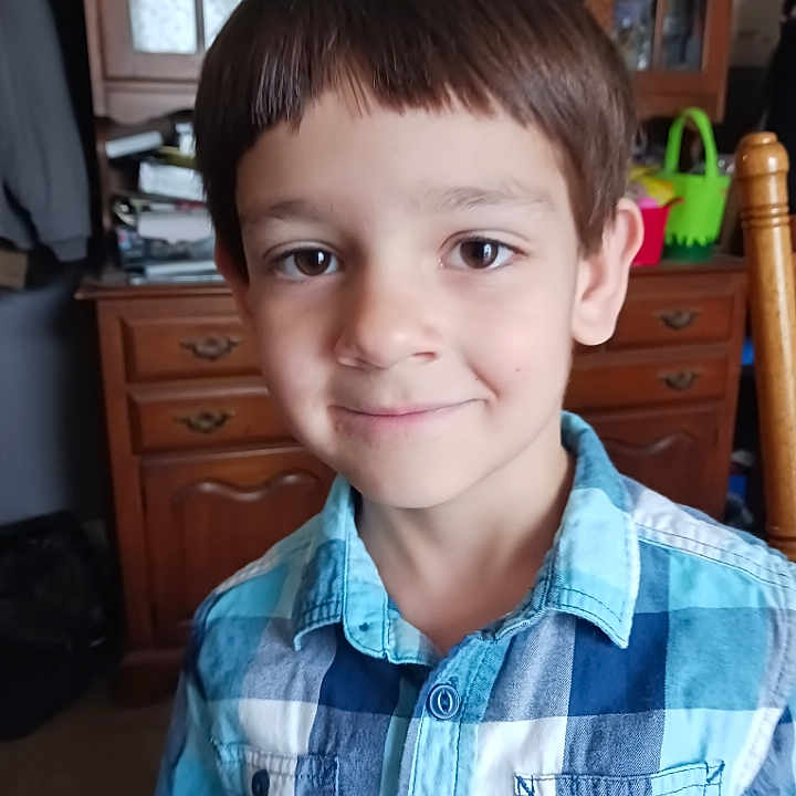Christopher is registered to the contest to win money with this photo: bookcase, boy, cabinet, child, closet, clothing, cupboard, face, furniture, happy, head, indoors, interiordesign, male, person, photography, portrait, shelf, shirt, smile