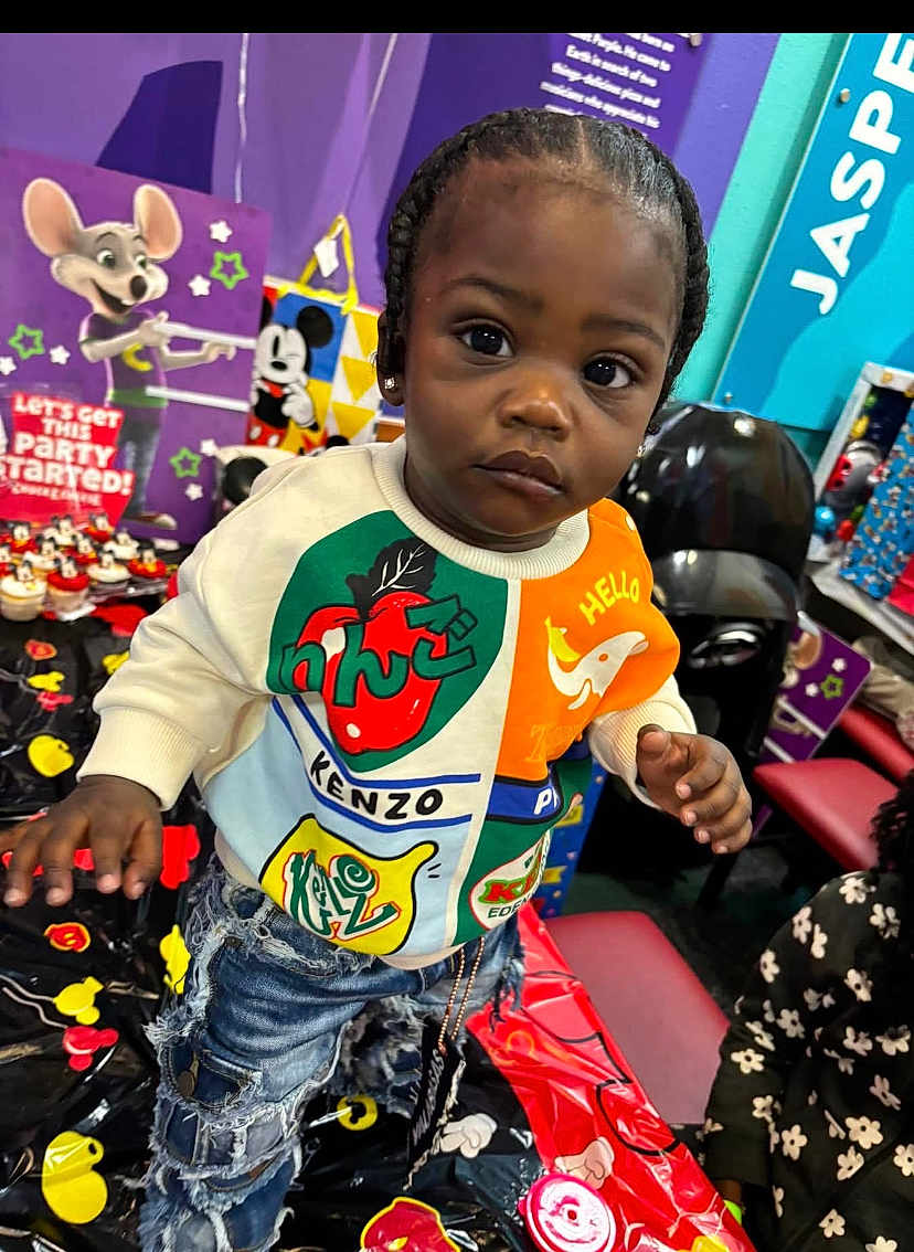 Brycen joined the competition — help win amazing prizes! toddler, child, kenzo, sweatshirt, ripped_jeans, party, table, mickey_mouse, cupcakes, decorations, colorful, indoor, person, face, hair, earrings, cartoon, background, celebration, curious