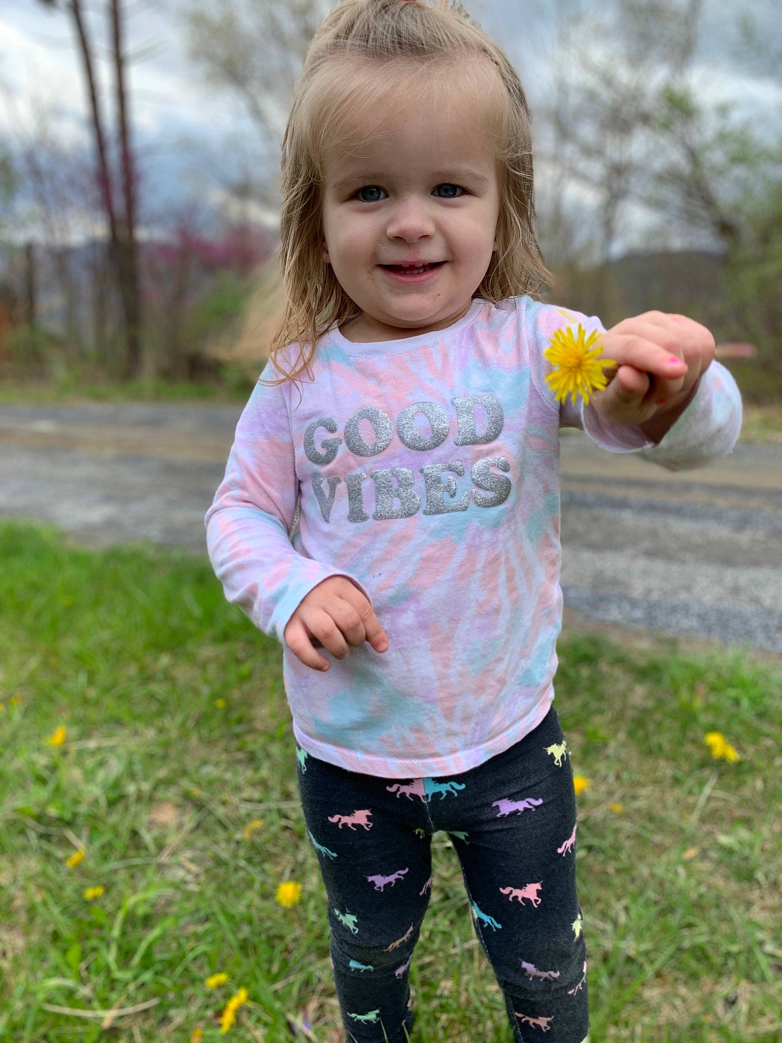 Ella is registered to the contest to win money with this photo: baby_toddler_clothing, child, face, facial_expression, fun, gesture, grass, hand, happy, head, joy, nature, people_in_nature, person, photograph, pink, plant, sleeve, smile, summer