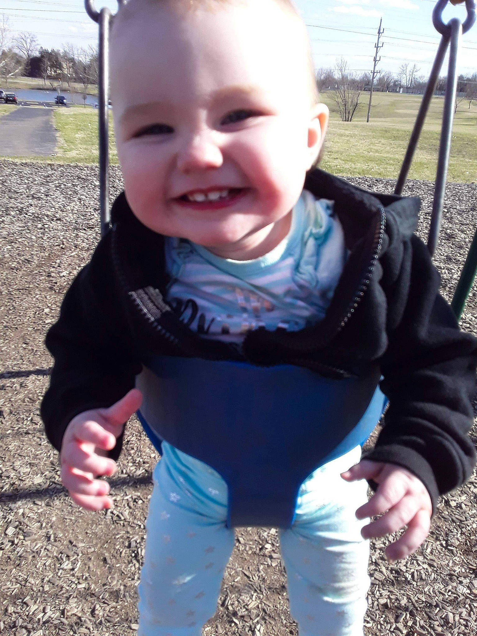 Kyah joined the competition — help win amazing prizes! baby, cheek, child, cool, face, facial_expression, fun, grass, head, joy, mouth, nose, outdoor_play_equipment, person, play, playground, public_space, skin, smile, swing