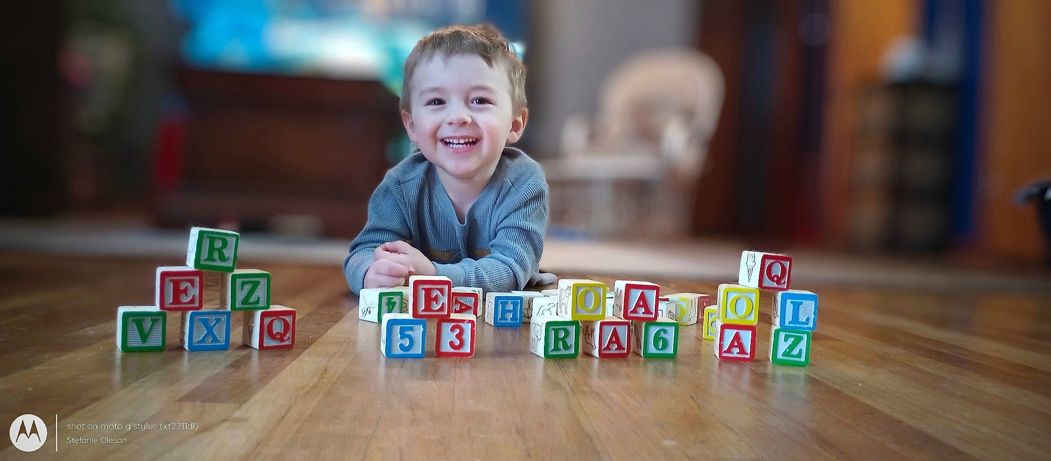 Rhykker joined the competition — help win amazing prizes! baby, carmine, child, educational_toy, flooring, fun, happy, hardwood, indoor_games_and_sports, joy, leisure, person, play, recreation, rectangle, sitting, smile, table, toddler, toy