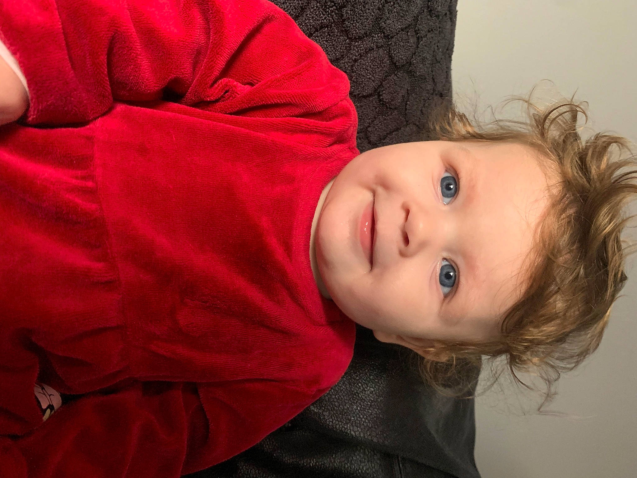 Lydia is registered to the contest to win money with this photo: cheek, child, chin, comfort, eyebrow, eyelash, facial_expression, flash_photography, happy, joy, lip, mouth, nose, person, plant, sitting, skin, sleeve, smile, toddler