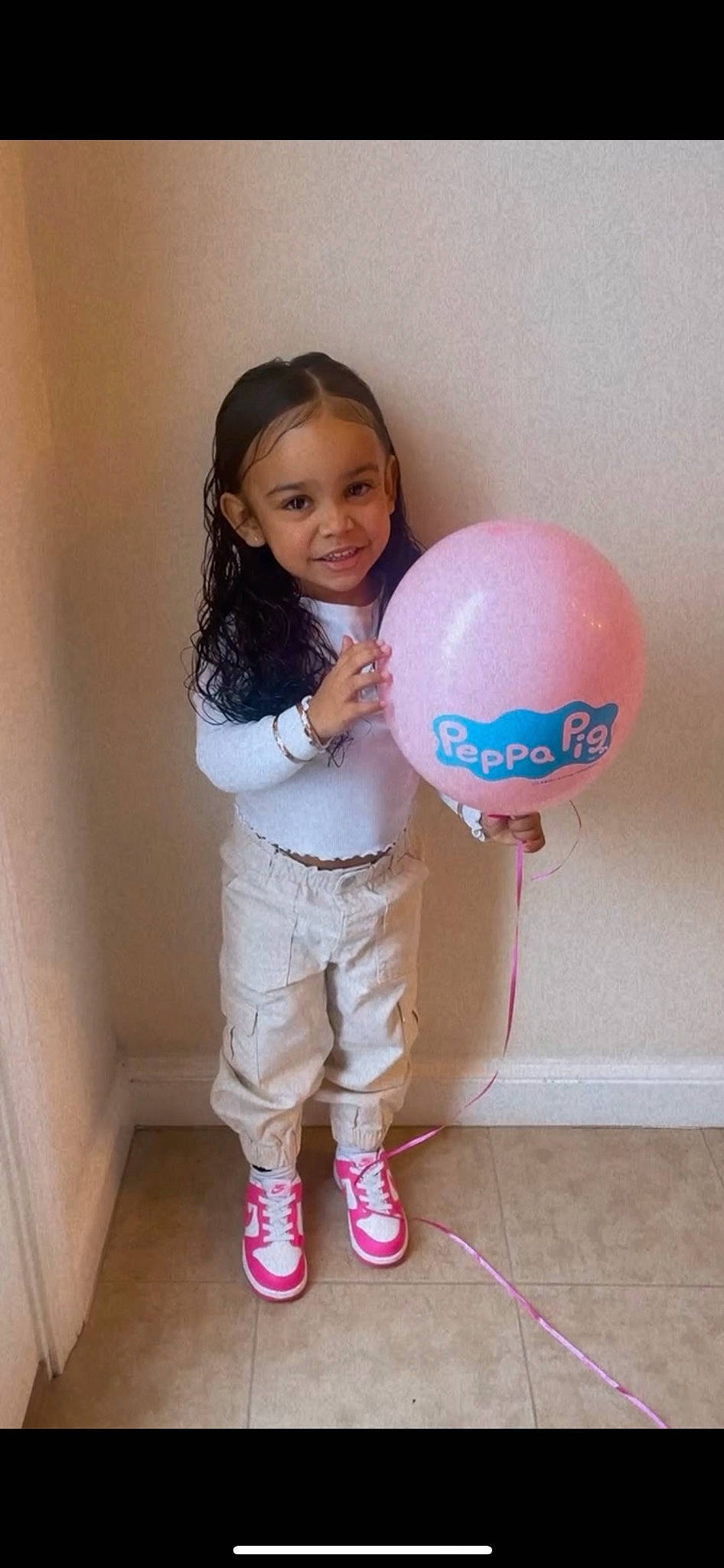 Delilah joined the competition — help win amazing prizes! baby_toddler_clothing, ball, balloon, child, flooring, fun, gesture, happy, human_leg, joy, knee, leisure, magenta, person, pink, shoulder, sleeve, smile, sock, t_shirt