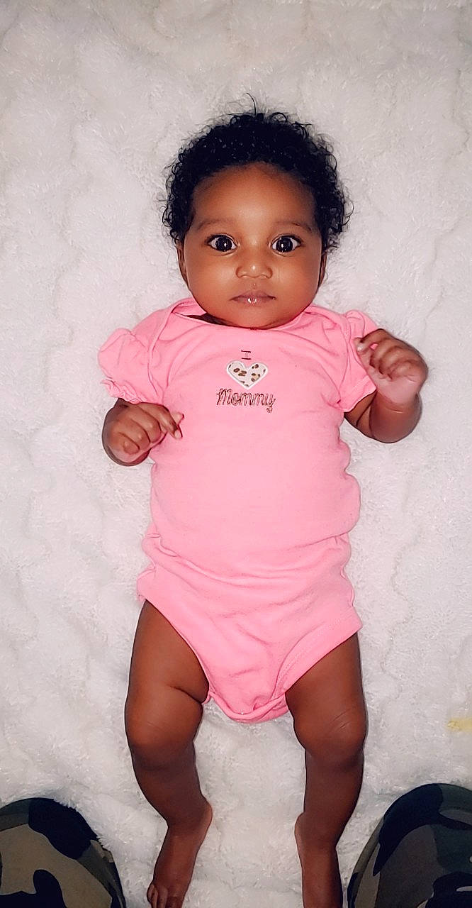 Aliya is registered to the contest to win money with this photo: baby, baby_products, baby_toddler_clothing, black_hair, cheek, child, person, pink, product, skin, stomach, thigh, toddler