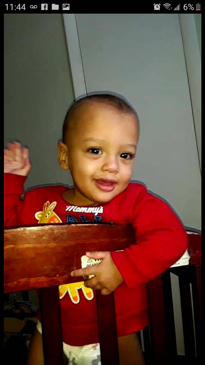 Langston is registered to the contest to win money with this photo: cheek, child, face, head, person, skin, smile, standing, toddler