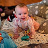 Stevie is registered to the contest to win money with this photo: baby, crawling, smiling, toy, blanket, pillow, indoor, child, face, hands, floor, clothing, colorful, pattern, cute, playtime, infant, happy, person, soft