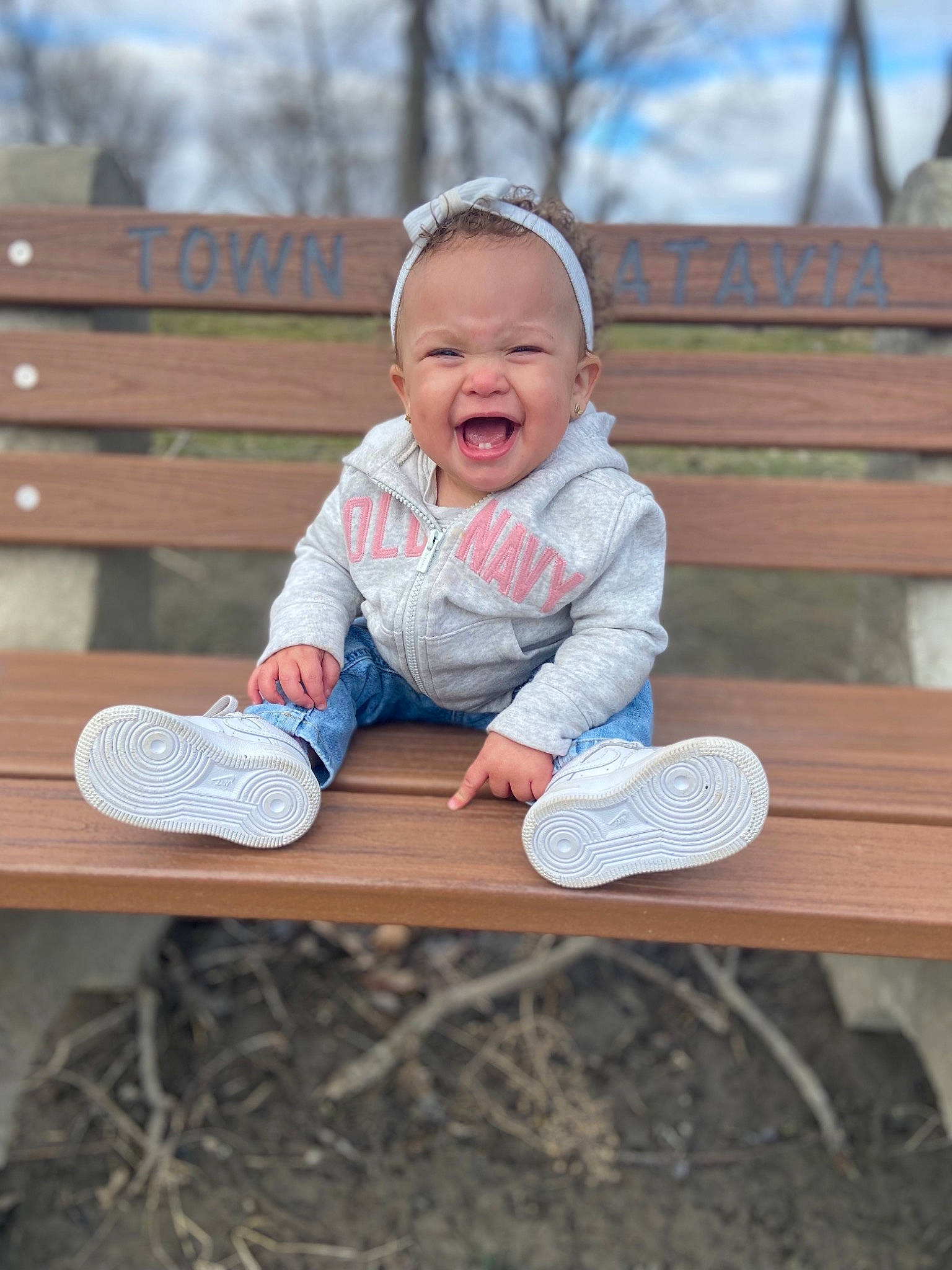 K'Amaiyah joined the competition — help win amazing prizes! baby_toddler_clothing, child, eye, face, fun, grass, happy, leaf, leisure, people, people_in_nature, person, shoe, sitting, sky, smile, sneakers, standing, toddler, tree