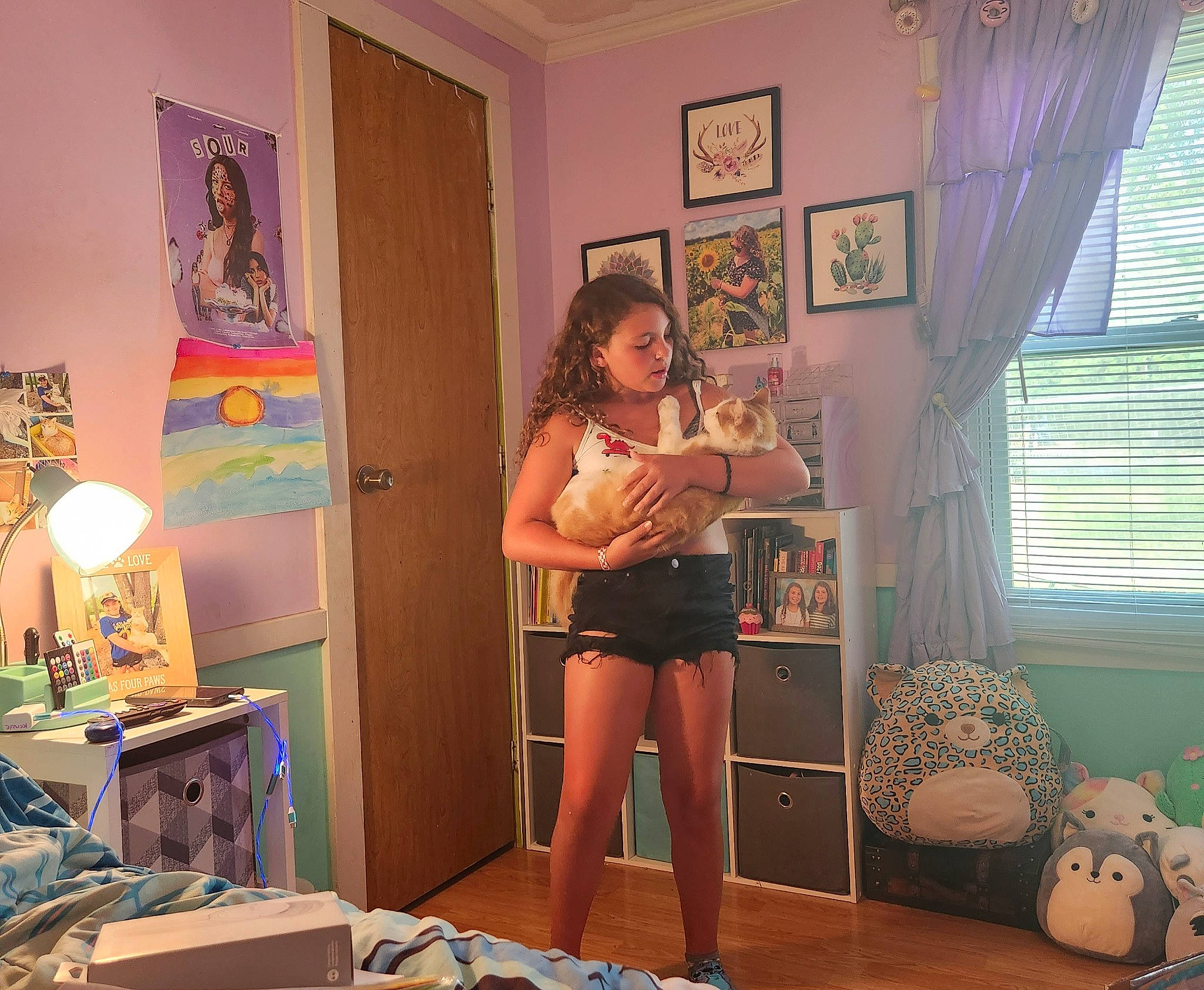 Mackenzie joined the competition — help win amazing prizes! abdomen, comfort, curtain, flooring, foot, house, human_leg, knee, lamp, living_room, person, picture_frame, room, shipping_box, table, thigh, waist, window, window_blind, window_covering