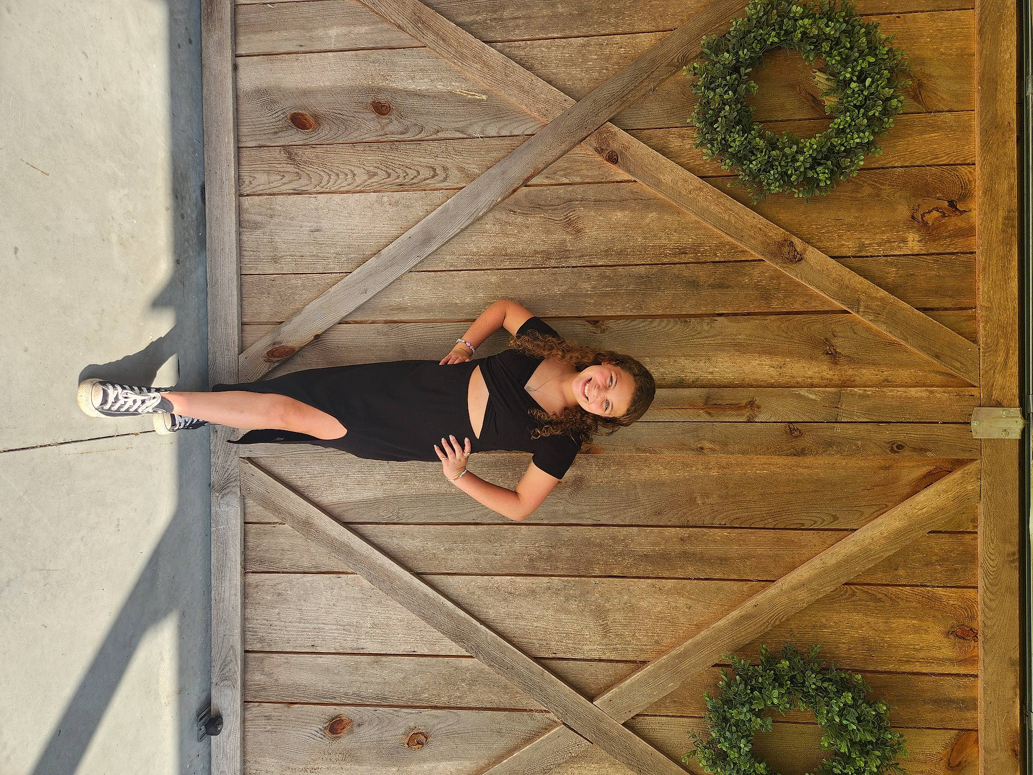Mackenzie is registered to the contest to win money with this photo: door, dress, floor, flooring, hand, hardwood, human_body, human_leg, joy, leisure, pattern, person, plank, plant, stairs, standing, sunglasses, tree, waist, window