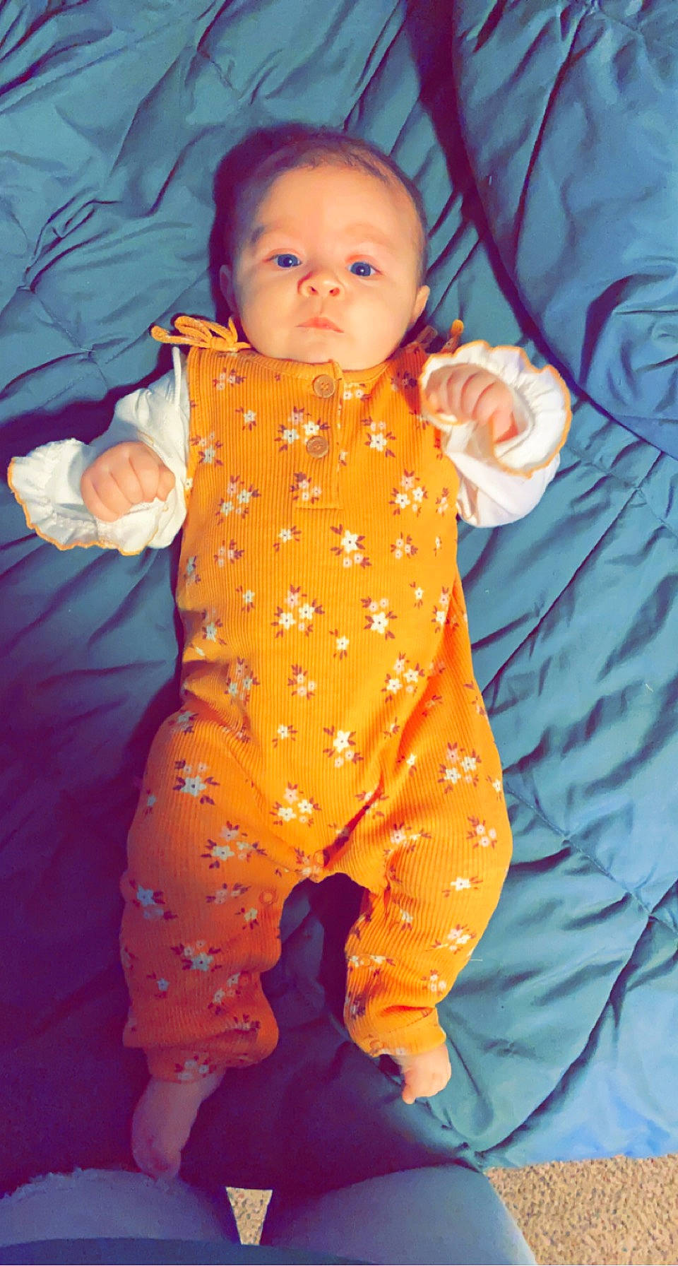 Brayleigh is registered to the contest to win money with this photo: baby, baby_products, baby_toddler_clothing, cheek, child, comfort, electric_blue, gesture, hand, head, linens, nightwear, nose, orange, pattern, peach, person, skin, sleeve, thumb