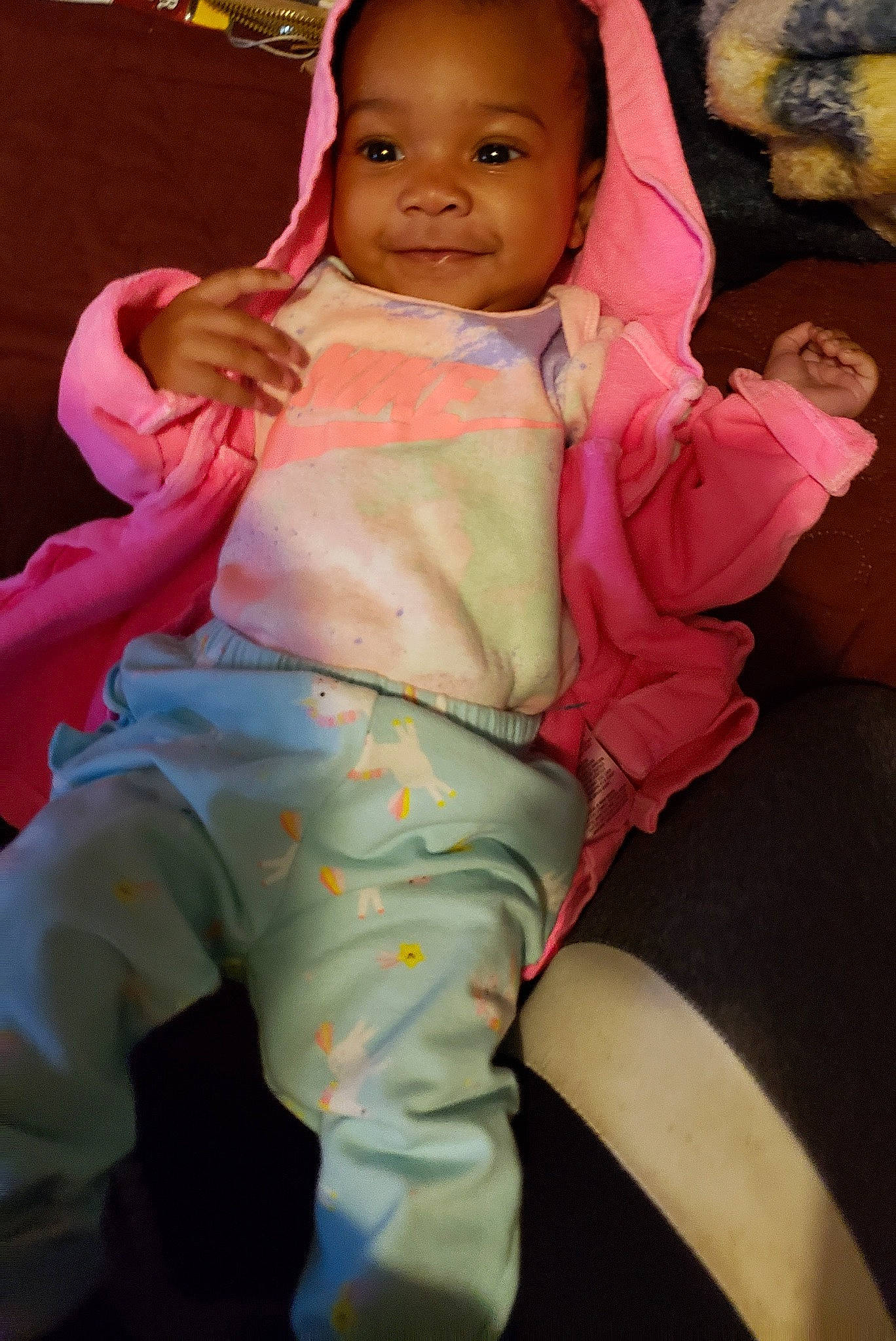 Ivy is registered to the contest to win money with this photo: baby, baby_toddler_clothing, cheek, child, comfort, elbow, finger, gesture, hand, happy, human_body, joy, leg, mouth, person, pink, skin, sleeve, smile, thumb