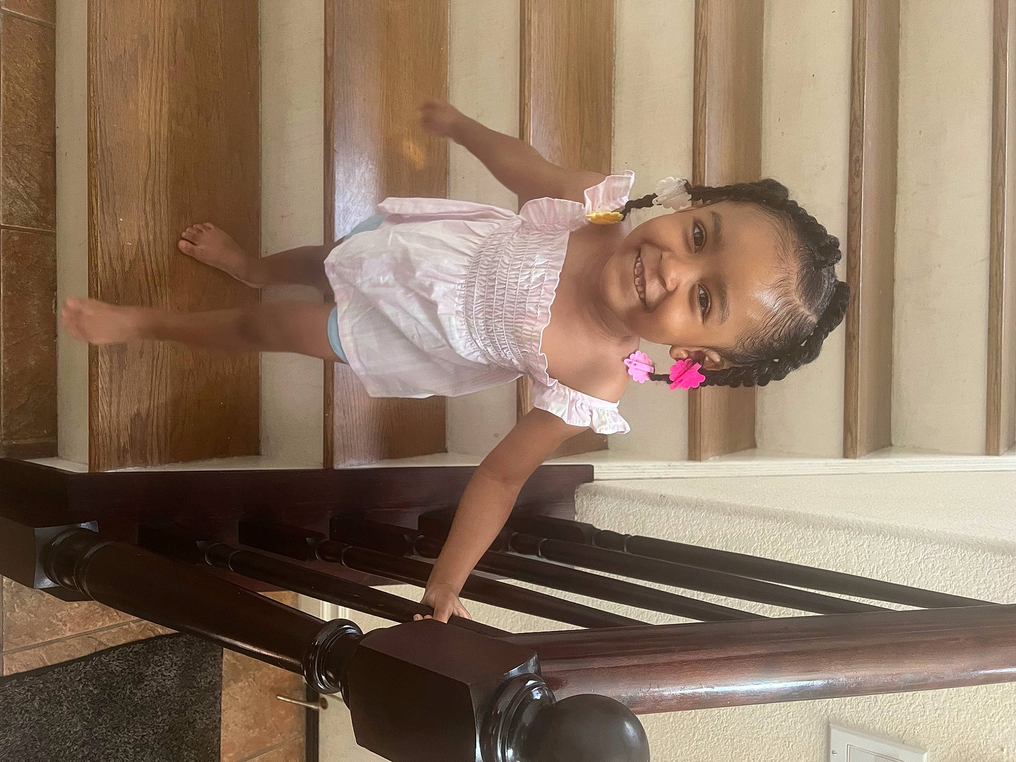 Jalayah is registered to the contest to win money with this photo: baby_toddler_clothing, child, dress, facial_expression, flooring, fun, happy, hardwood, human_leg, joy, leisure, magenta, metal, musical_instrument, pattern, person, sitting, smile, t_shirt, thigh