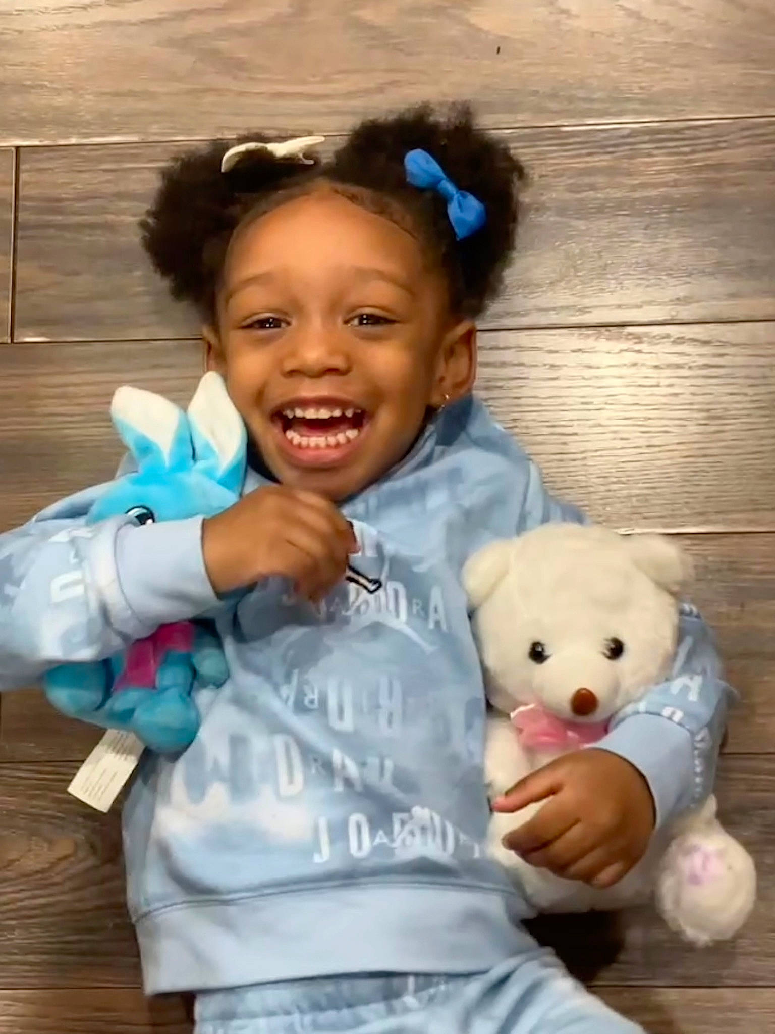 Arabella joined the competition — help win amazing prizes! baby_toddler_clothing, cheek, child, companion_dog, facial_expression, fun, gesture, happy, joy, nose, person, pink, sitting, skin, sleeve, smile, stuffed_toy, teddy_bear, thumb, toddler