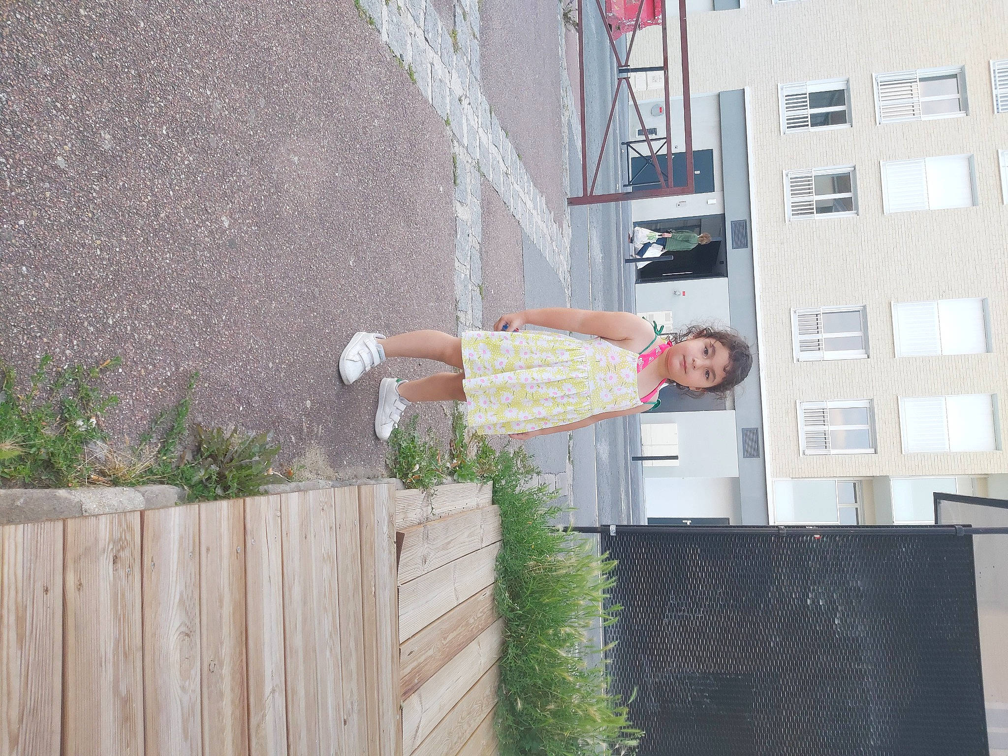 Gülser participe au concours pour gagner de l'argent avec cette photo : apartment, balcony, brick, brickwork, building, concrete, condominium, facade, handrail, house, human_leg, person, plant, shorts, smile, thigh, urban_design, window, wood