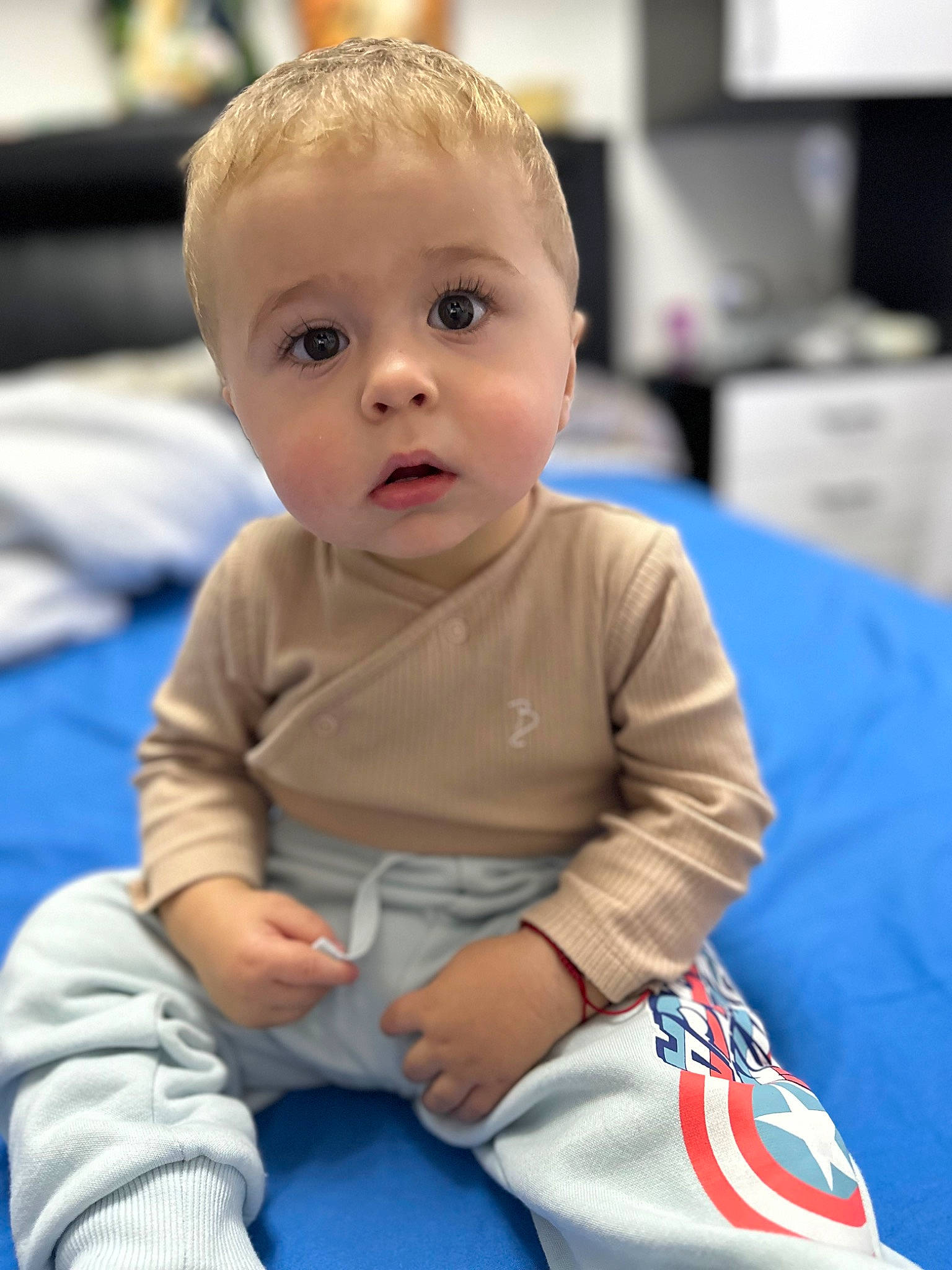 David joined the competition — help win amazing prizes! baby, baby_products, baby_toddler_clothing, cheek, child, chin, comfort, elbow, electric_blue, flooring, fun, happy, head, person, room, sitting, skin, sleeve, surprise, t_shirt