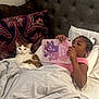 Carmello is registered to the contest to win money with this photo: child, cat, bed, tablet, pillow, blanket, headboard, indoor, relaxing, patterned_pillow, care_bears, white_cat, brown_cat, braided_hair, tablet_case, resting, cozy, furniture, home, portrait